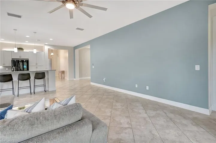 Tiled living room with ceiling fan