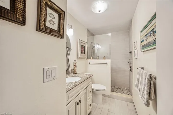 Updated primary bathroom with walk in shower