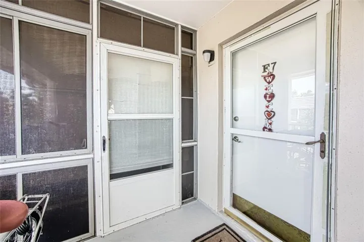 View of property entrance - front door to condo and door to lanai!