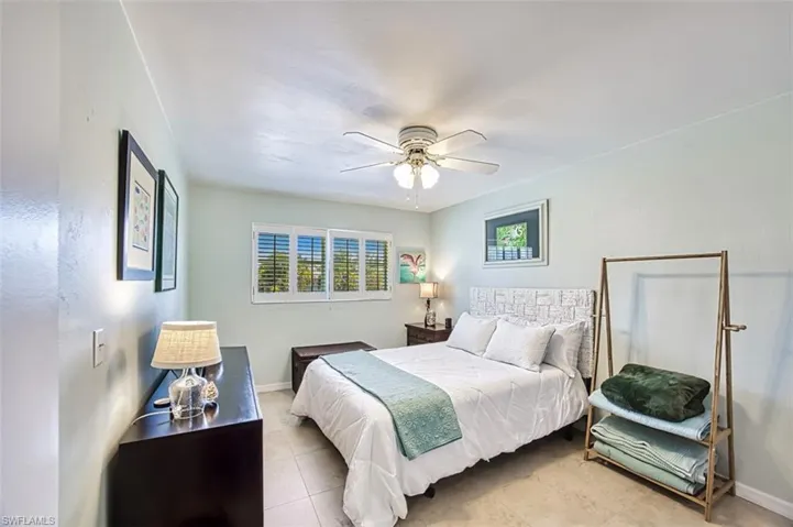 Guest bedroom with impact windows and Plantation shutters