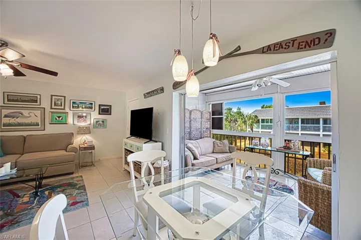 Dining area and enclosed lanai with an exit door
