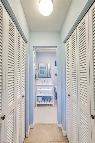 Hallway to half bath and two closets
