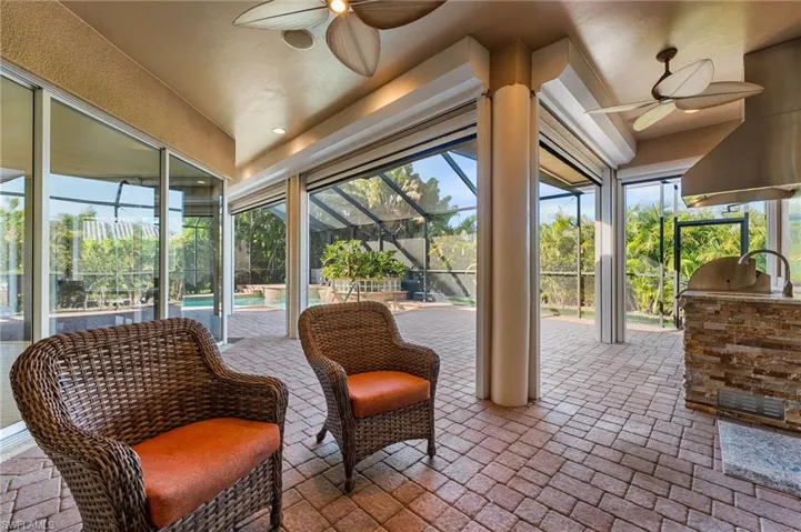 The lanai has an abundance of covered space which is perfect for year round entertaining! Outdoor kitchen. Pavered pool deck.