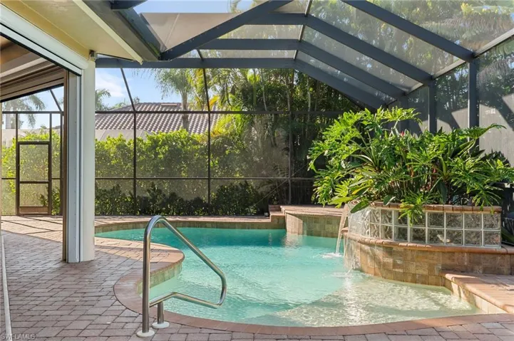 Custom designed heated pool with a sunshelf.