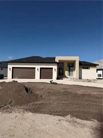 Front of property - home under construction.
