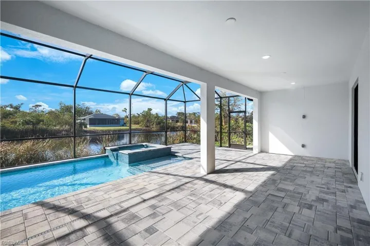 Lanai with view of pool-spa and canal in finished home