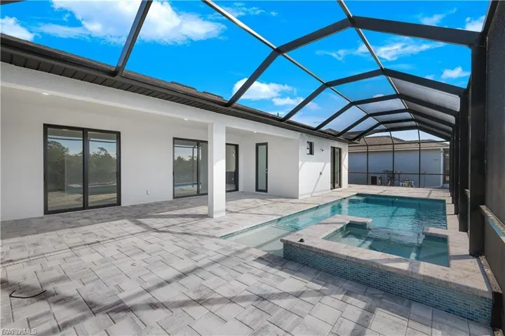 View of pool and spa at finished home