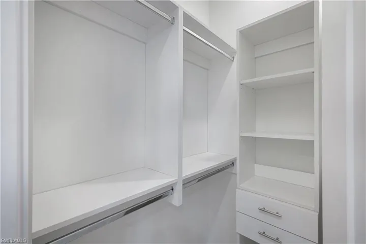 His-Her walk in California closet in finished home