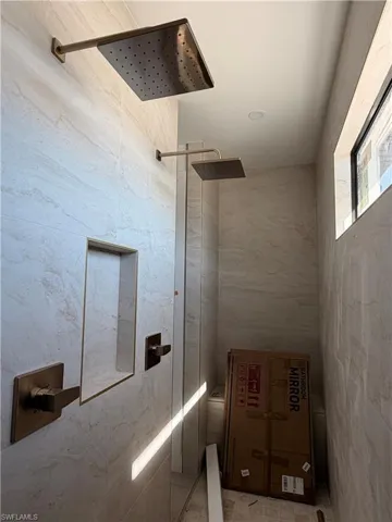 Bathroom with a duo-shower head - home under construction