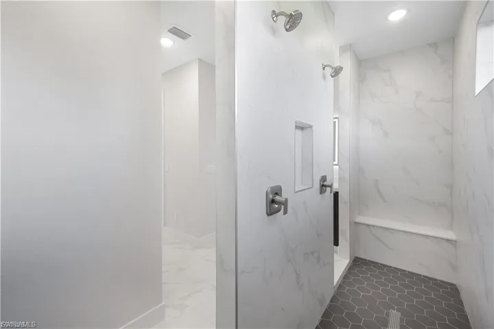 Master bath with duo shower heads in finished home.