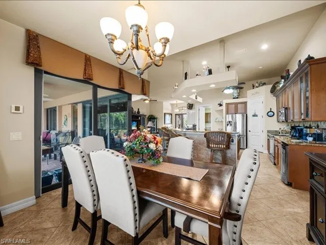 Dining area with a chandelier and light tile patterned floors