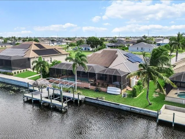 Aerial perspective of suburban area featuring a large body of water