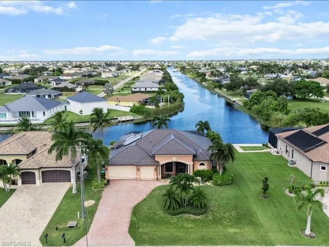 Aerial view of residential area with a large body of water