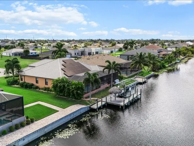 Aerial perspective of suburban area with a nearby body of water