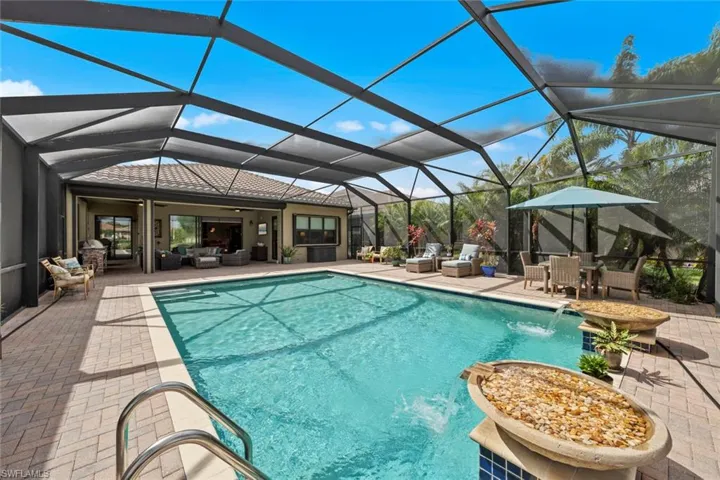 Pool featuring a lanai, outdoor lounge area, a patio, and ceiling fan