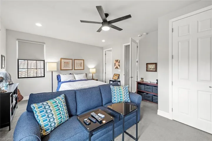Upstairs Bedroom featuring recessed lighting, baseboards, a ceiling fan, and light colored carpet