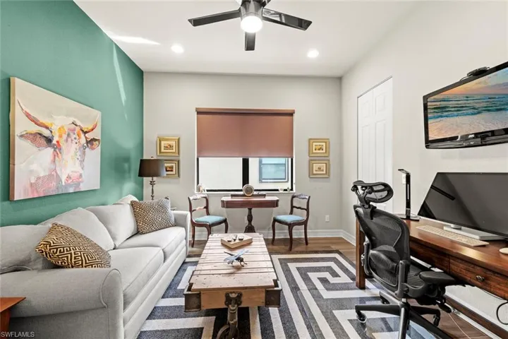 Den/Office featuring a closet, recessed lighting, ceiling fan, baseboards, and wood finished floors