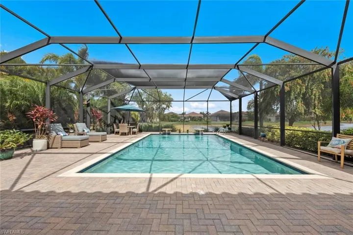 Outdoor pool featuring a lanai and a patio