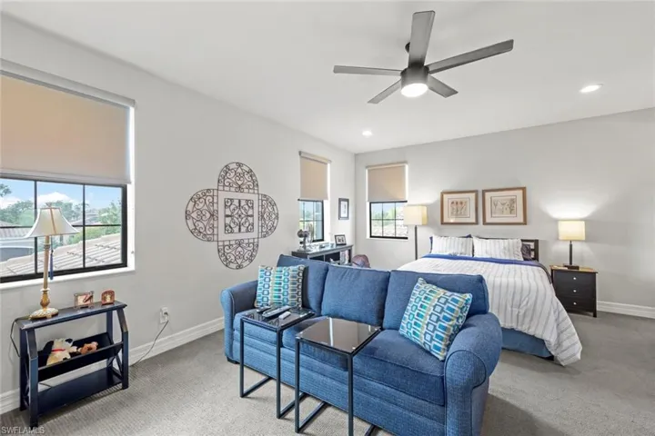 Upstairs Bedroom featuring recessed lighting, baseboards, a ceiling fan, and light colored carpet