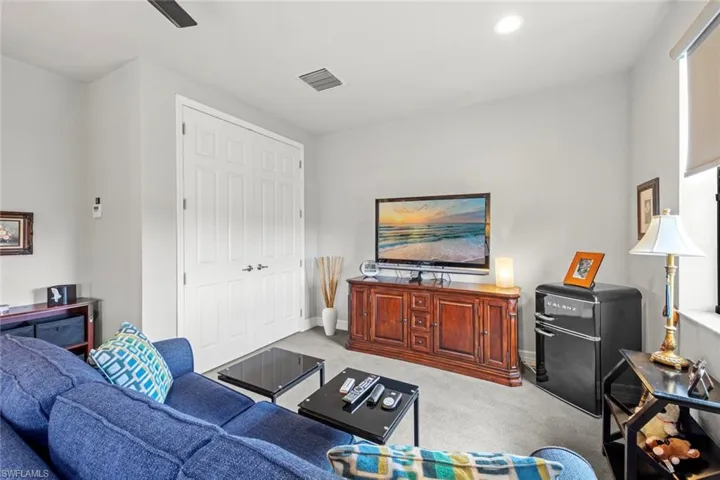 Upstairs Bedroom featuring recessed lighting, baseboards, a ceiling fan, and light colored carpet