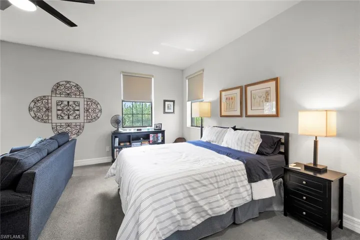 Upstairs Bedroom featuring recessed lighting, baseboards, a ceiling fan, and light colored carpet