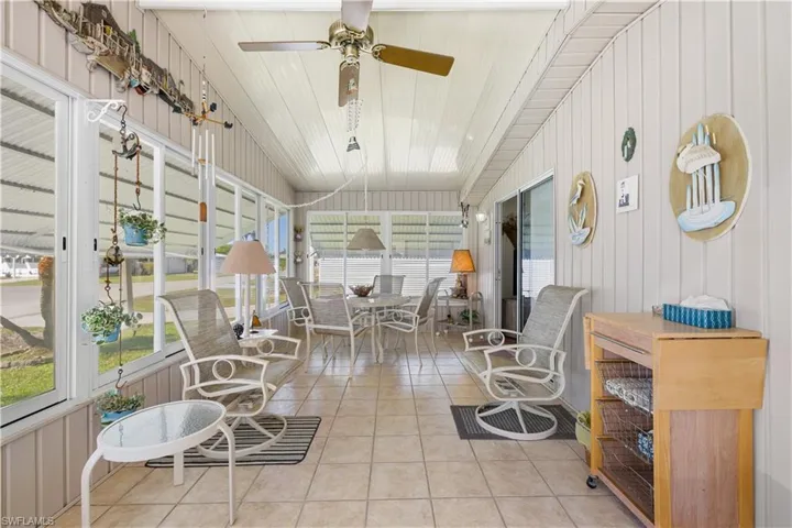 Sunroom with ceiling fan and plenty of natural light