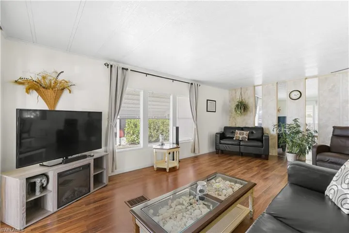 Living room with wood-type flooring