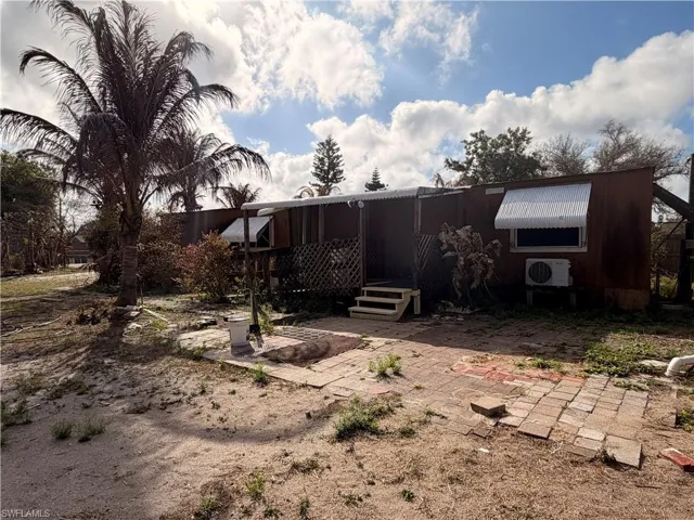 Back of property with a patio area