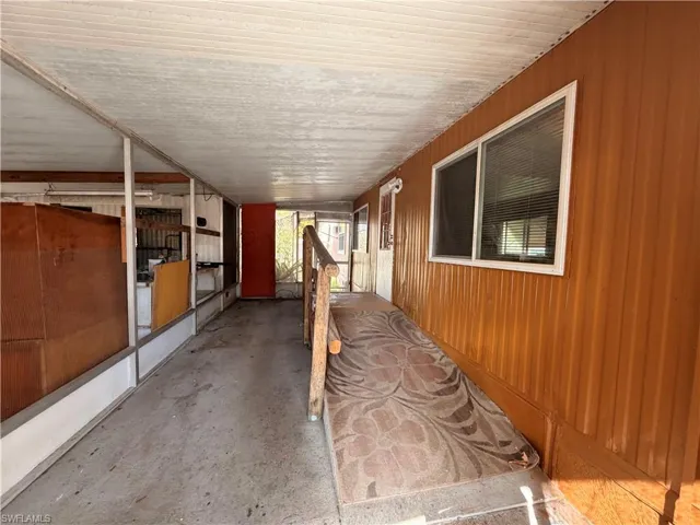 View of patio featuring an outbuilding and an exterior structure