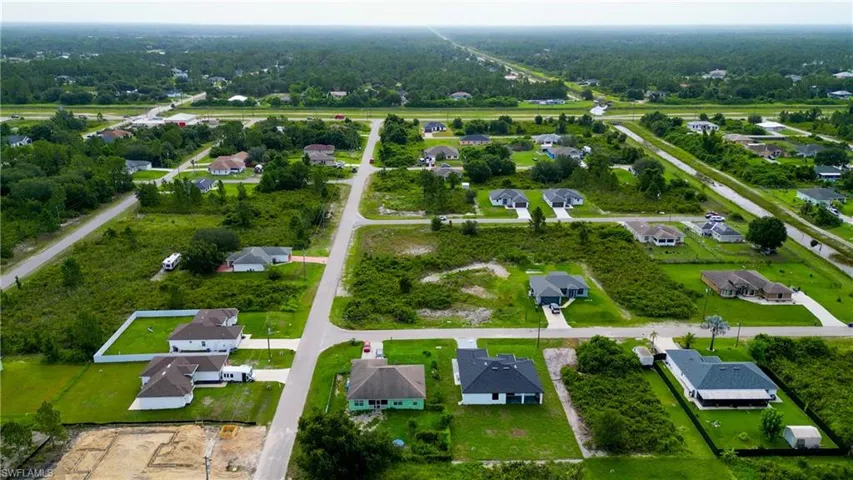 Aerial view of a residential area featuring multiple single-family homes on individual parcels