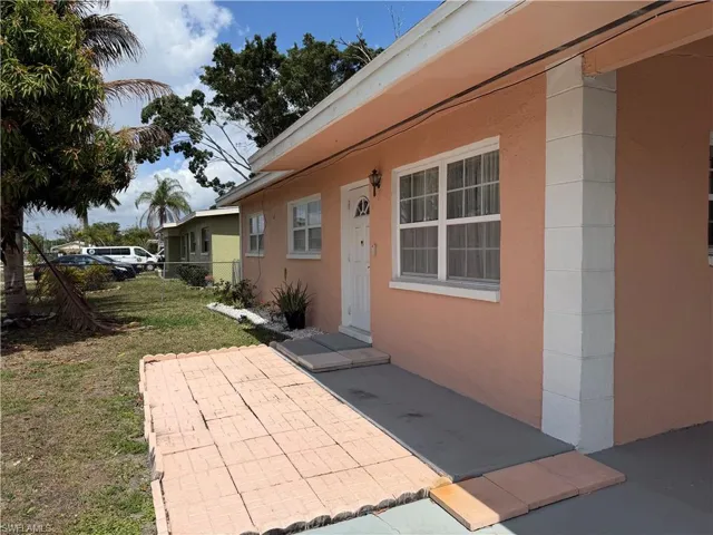 Entrance to property featuring stucco siding