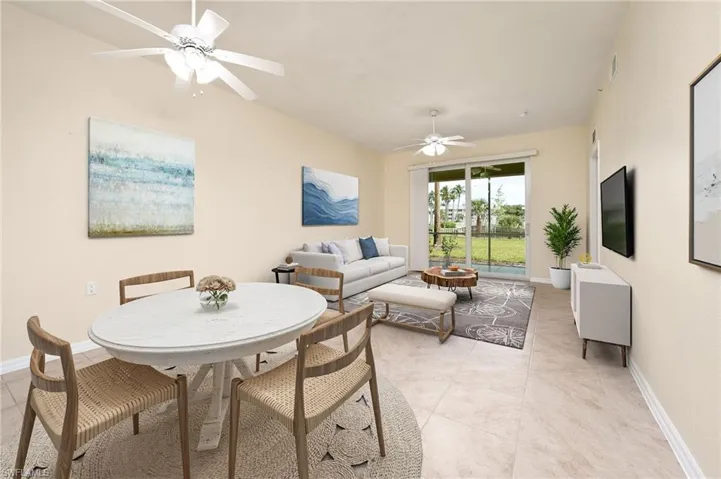LIVING ROOM / DINING ROOM WITH LAKE VIEWS - PHOTO IS STAGED.
