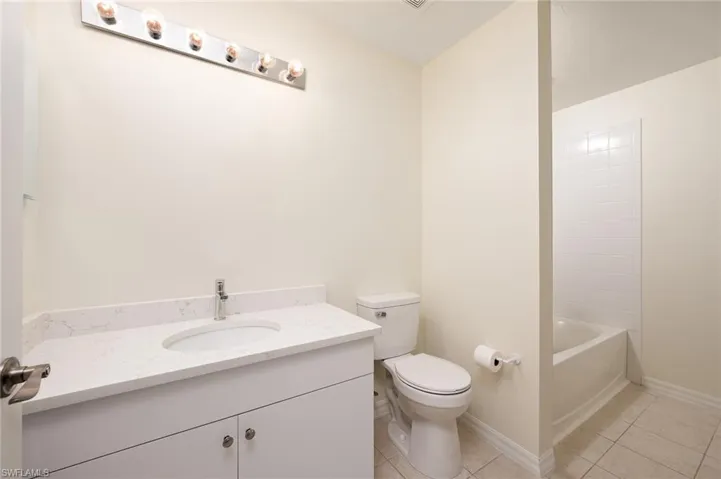 GUEST BATH WITH TUB/SHOWER COMBINATION. WASHER/DRYER IN CLOSET ADJACENT TO TUB/SHOWER.