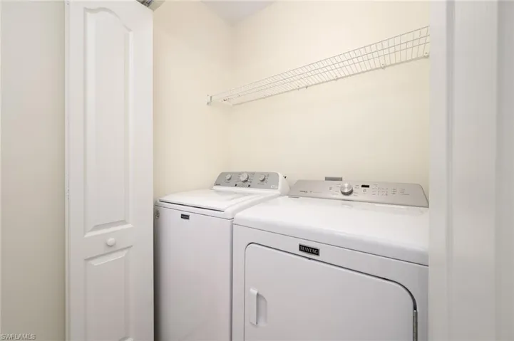 NEW WASHER AND NEARLY NEW DRYER INSIDE LAUNDRY ADJACENT TO TUB/SHOWER COMBINATION.