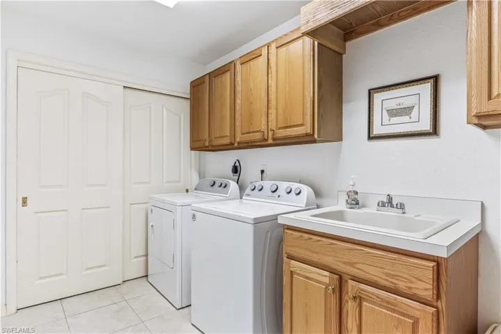 Laundry room with built-in cabinets
