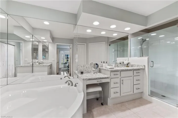 2nd view of primary bath - frameless shower and large soaking tub