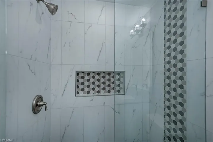 Bathroom featuring a tile shower