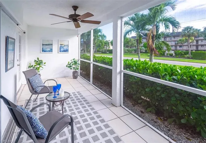 Sunroom featuring ceiling fan