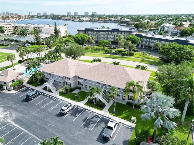 Birds eye view of property featuring a water view