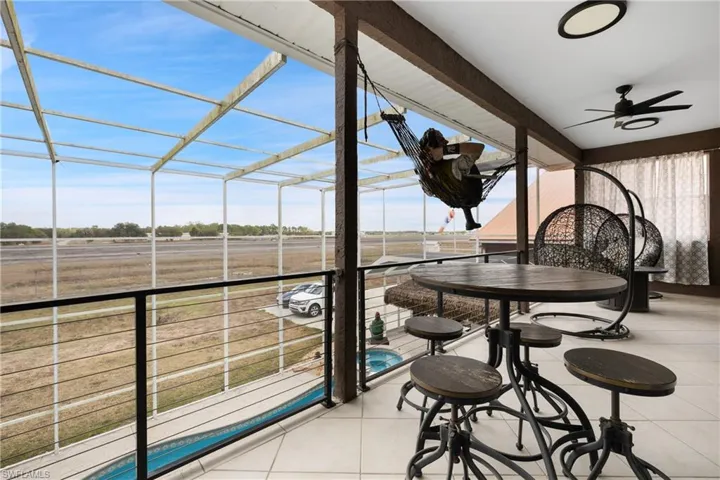 Sunroom with a ceiling fan