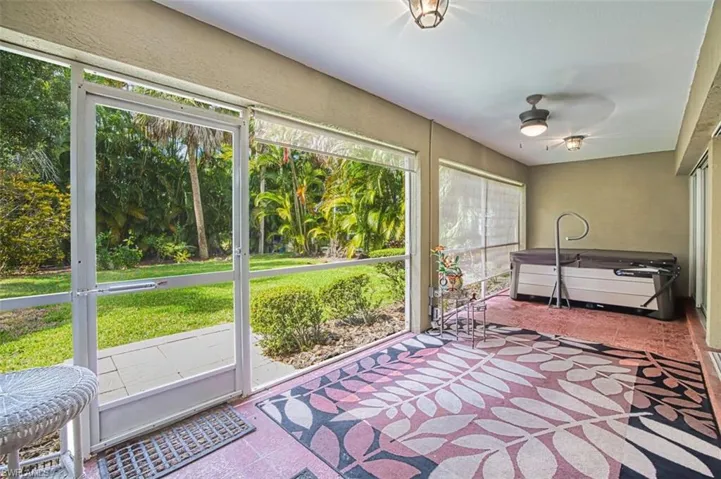 Sunroom / solarium with a ceiling fan