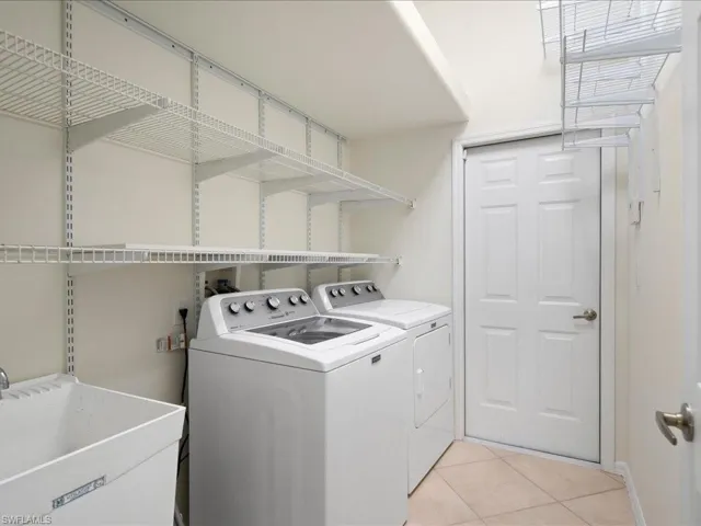 Laundry room adjacent to garage