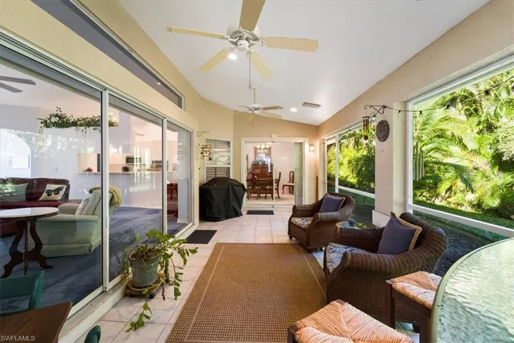 Sunroom with lofted ceiling and ceiling fan