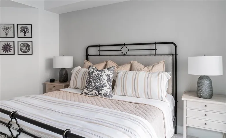 Bedroom 3 crisp and bright with carpeted floors