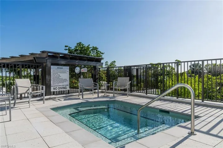 Peaceful spa surrounded by palm trees and tranquil atmosphere.