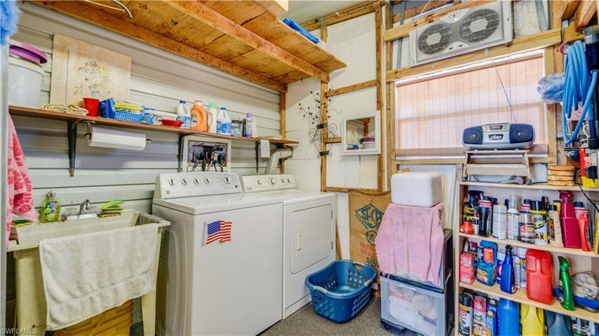 The  8' x 12' laundry area is complete with a laundry tub and much storage space. The roof is insulated and the window is newer.