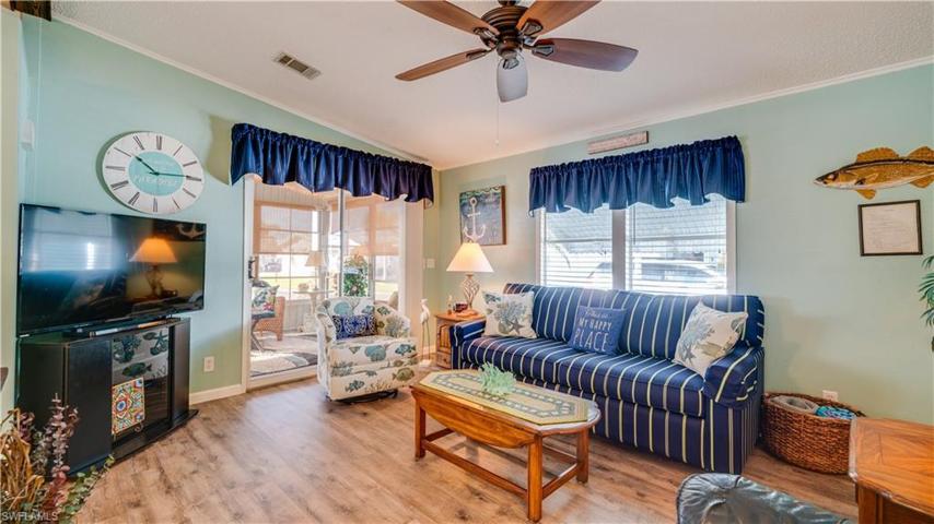The LVT flooring leads to the welcoming 10' x 12' front lanai.