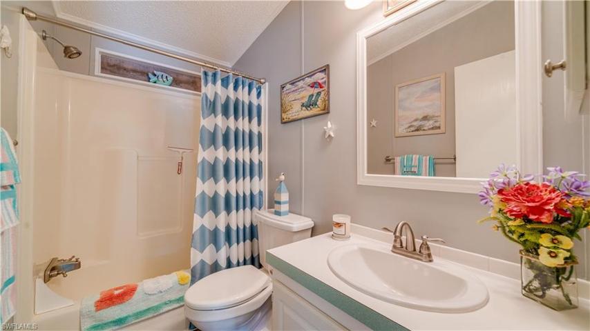 Two steps from the guest bedroom you'll find a well appointed guest bath.