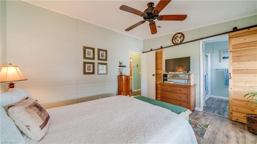 This master suite is just steps to the en suite; just behind the sliding barn doors.