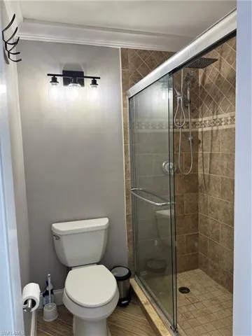 Bathroom featuring a shower stall